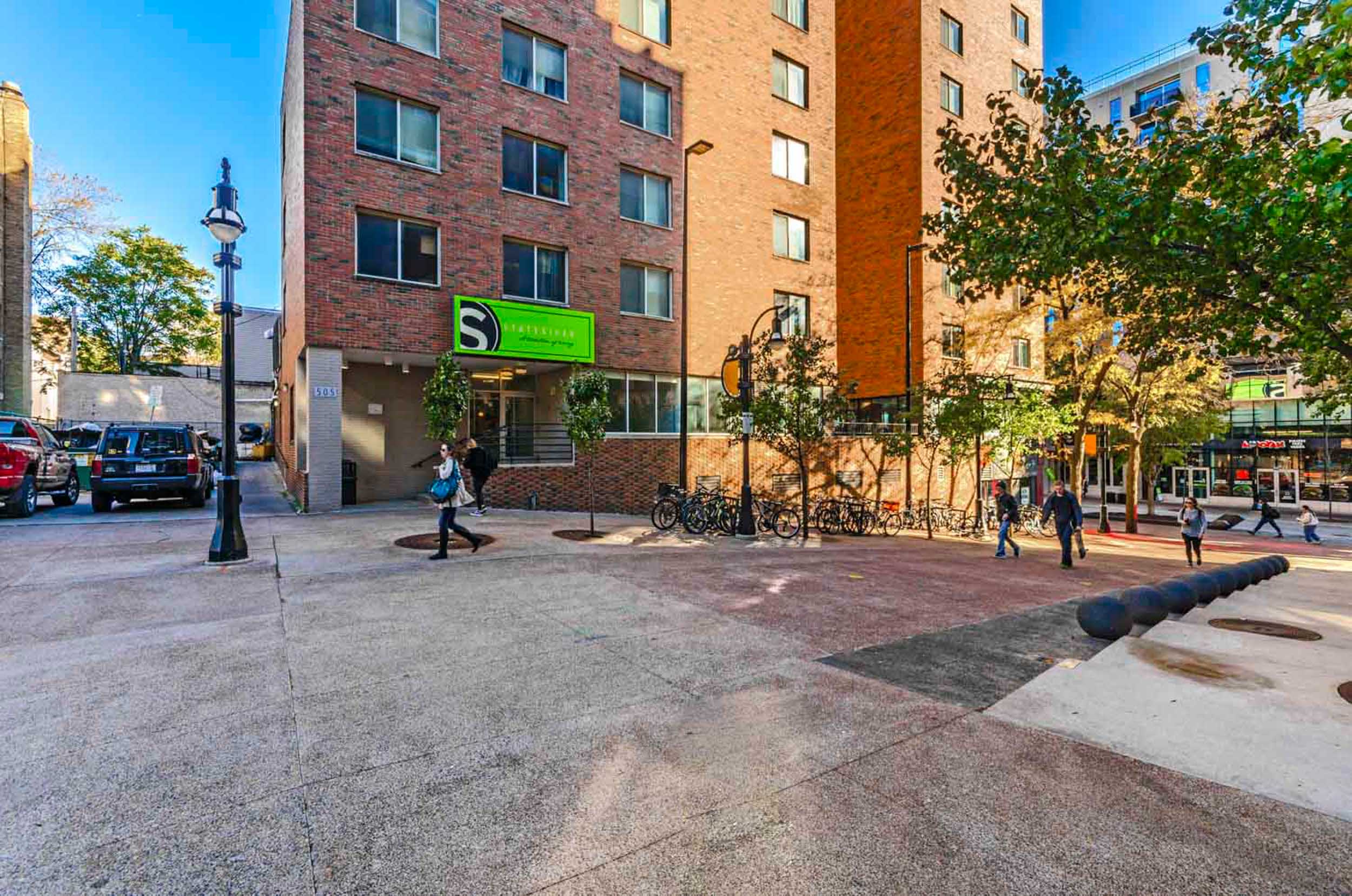 Outdoor courtyard in front of brick apartment building