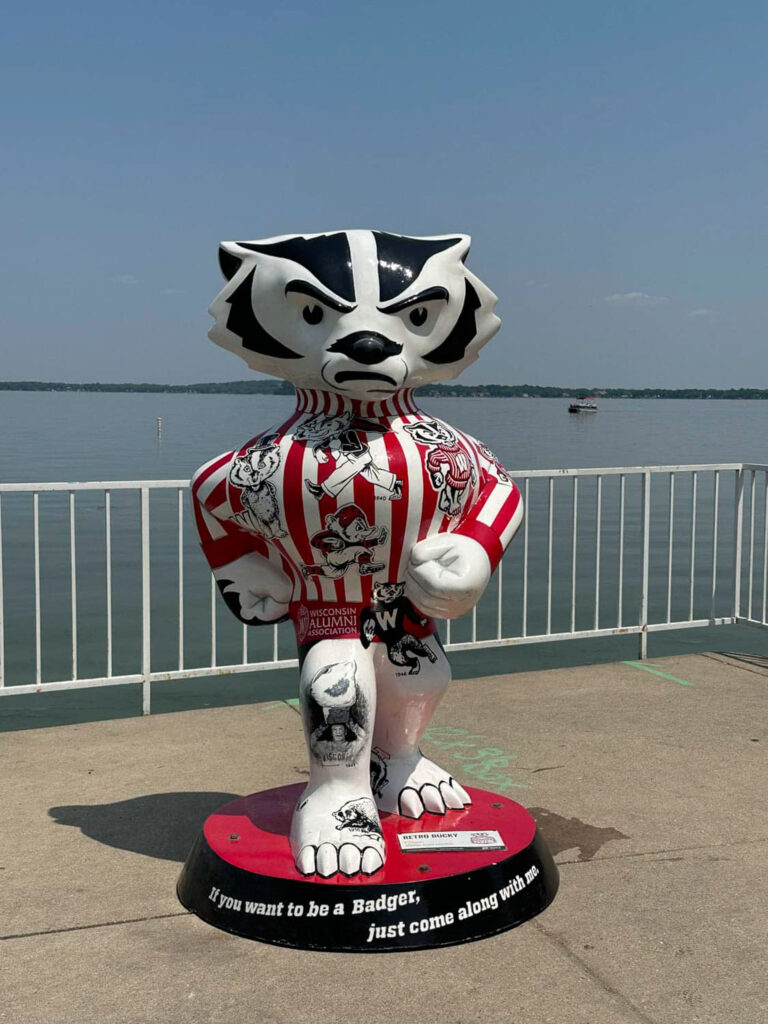 Statue of University of Wisconsin badger mascot next to the water